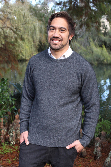 Man wearing charcoal grey possum and merino wool jumper