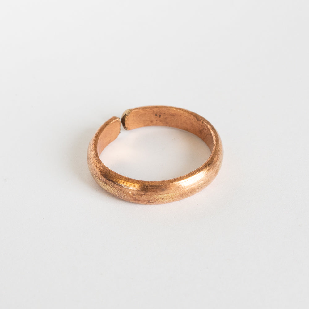 Copper ring on white background