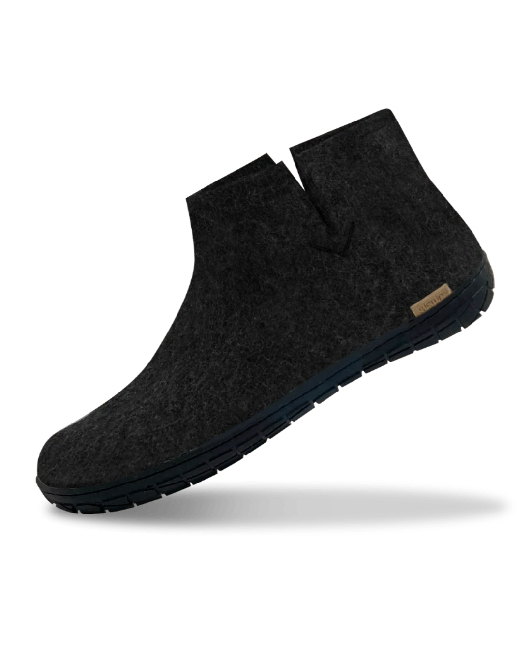 A single dark charcoal gray wool felt ankle boot with a black sole, shown floating at an angle against a white background.