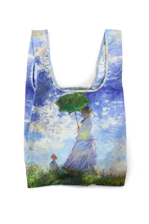 Reusable shopping bag with a Monet painting design of a woman holding an umbrella in a landscape.
