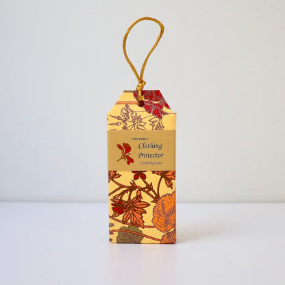 Lemongrass scented clothing protector moth repellent sitting on table with string on top for hanging in wardrobe